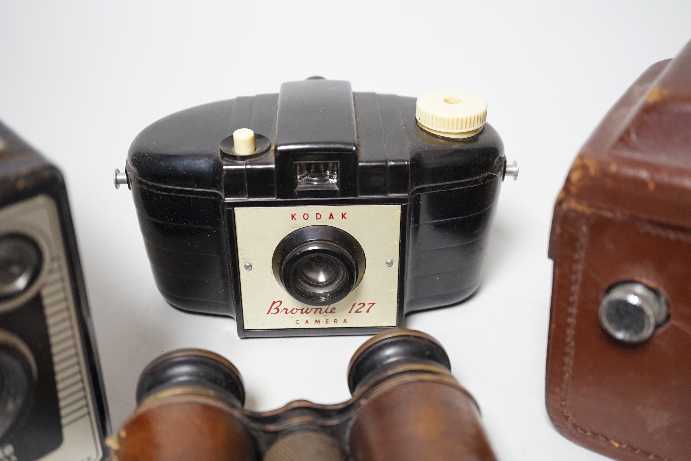 A quantity of camera equipment and a pair of military binoculars